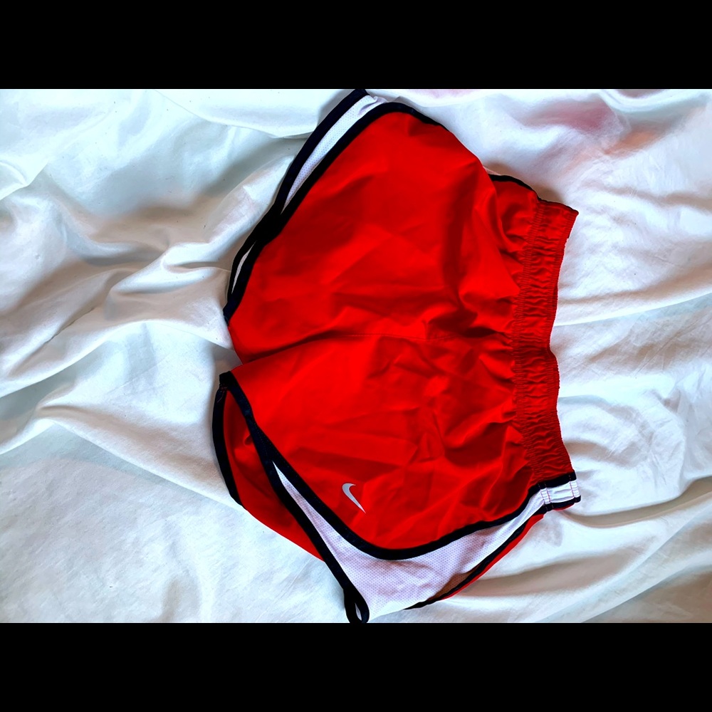 Red Nike running shorts